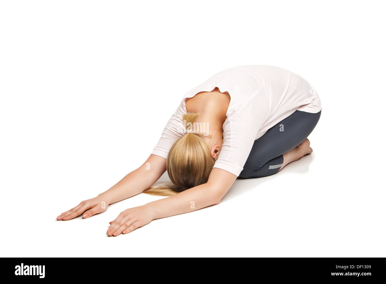 Young woman doing yoga isolated against white background Stock Photo ...