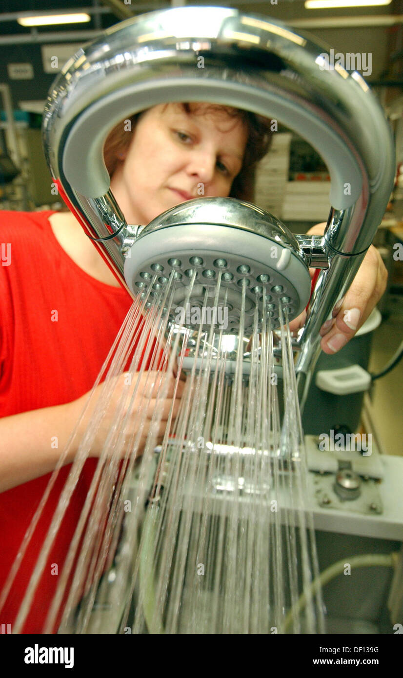 (FILE) An archive photo dated 13 September 2004 shows employee Carmen Mueller checking a shower by Marke Freehander at the Grohe Water Technology AG & Co KG in Herzberg, Germany. Lixil together with the Development Bank of Japan acquired 87.5 percent of the stock, according to Grohe on Thursday in Duesseldorf. Photo: PATRICK PLEUL Stock Photo