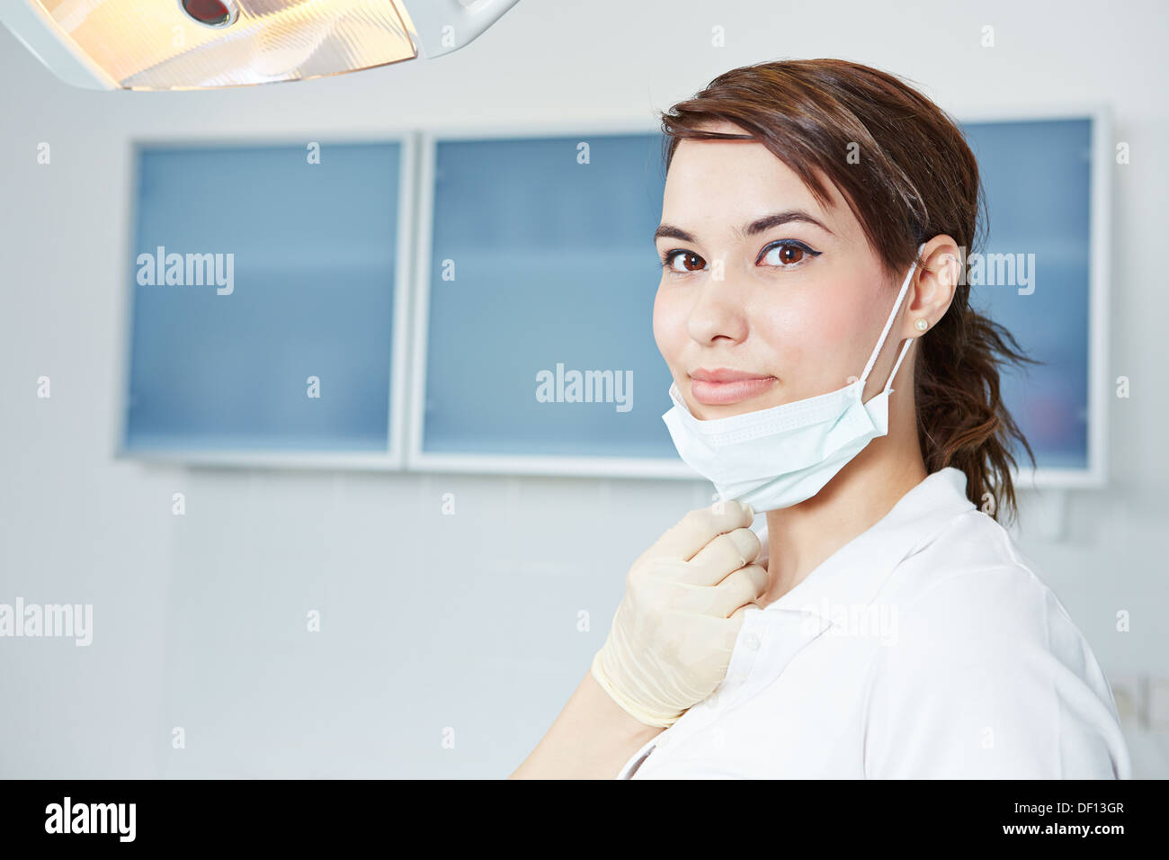Smiling dental assistant with mouthguard in dental practice Stock Photo