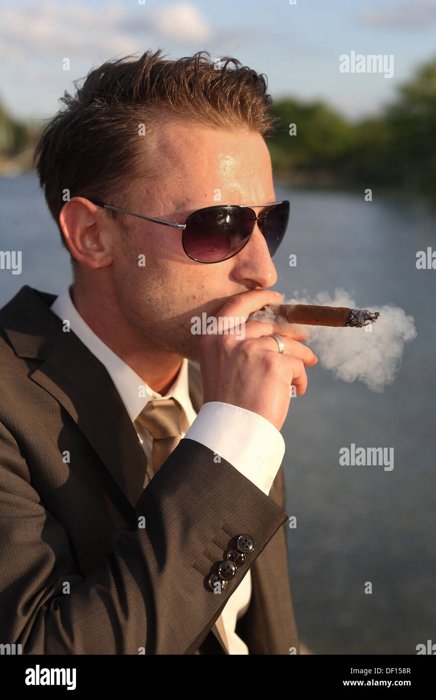 Berlin, Germany, man smoking a cigar Stock Photo