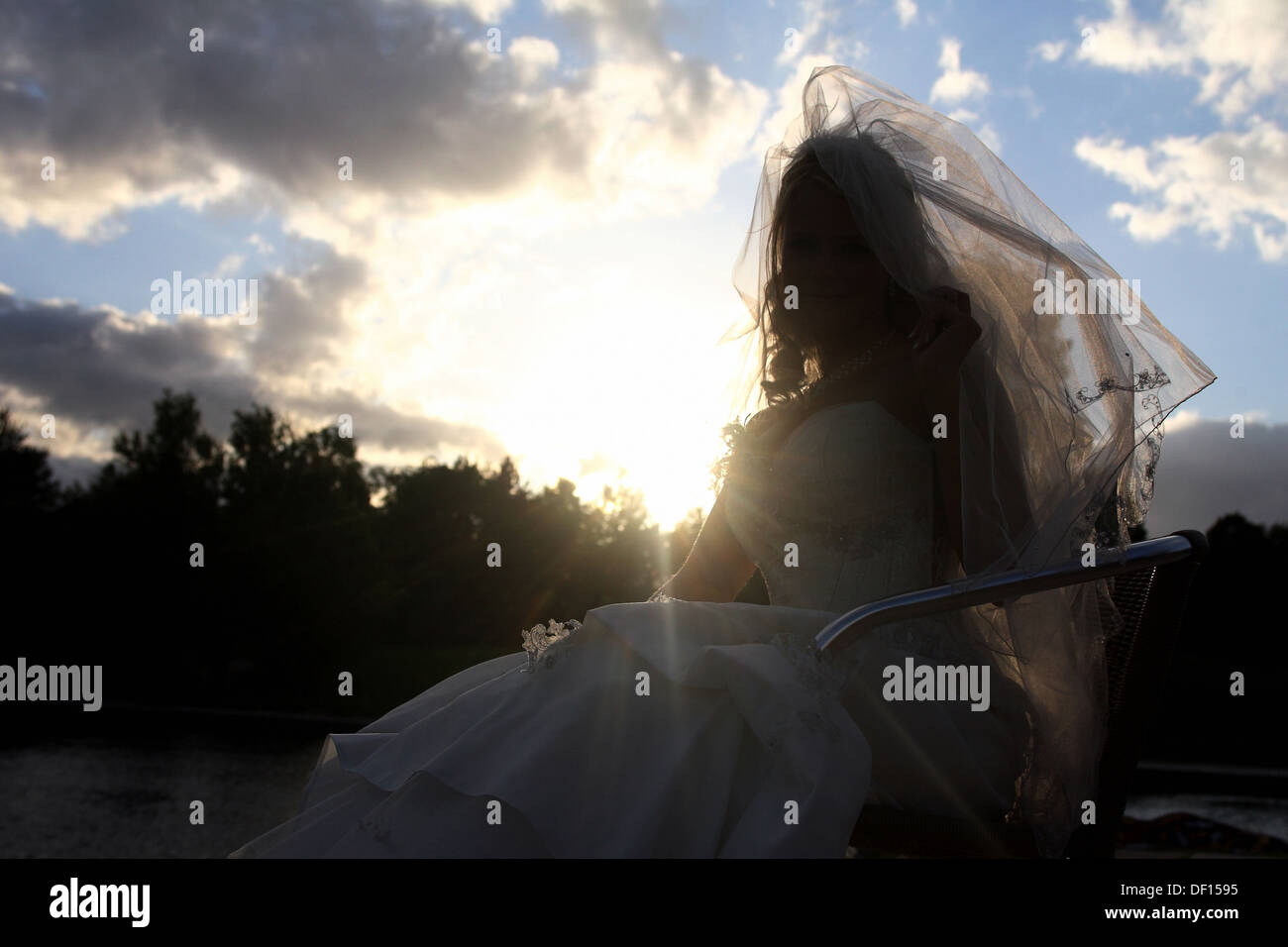 Berlin, Germany, a bride in wedding dress in the back light Stock Photo