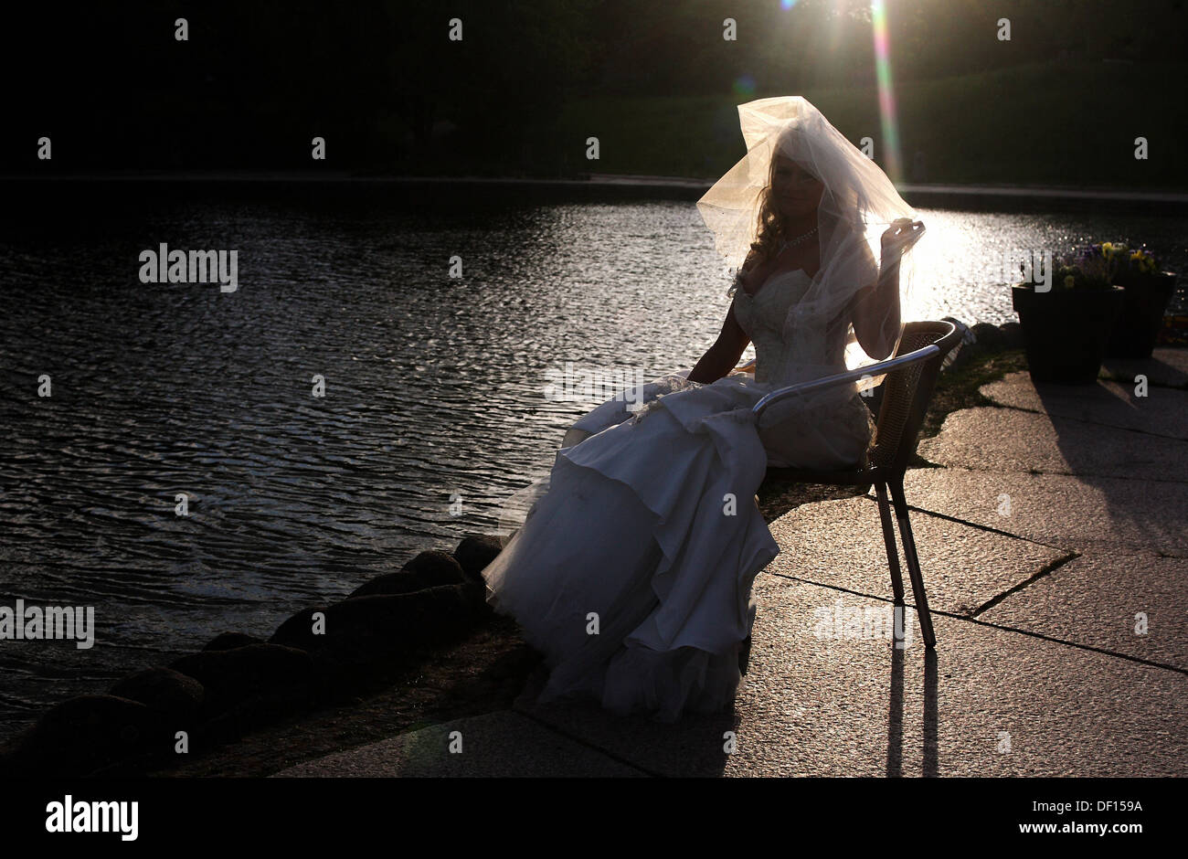 Berlin, Germany, a bride in wedding dress in the back light Stock Photo