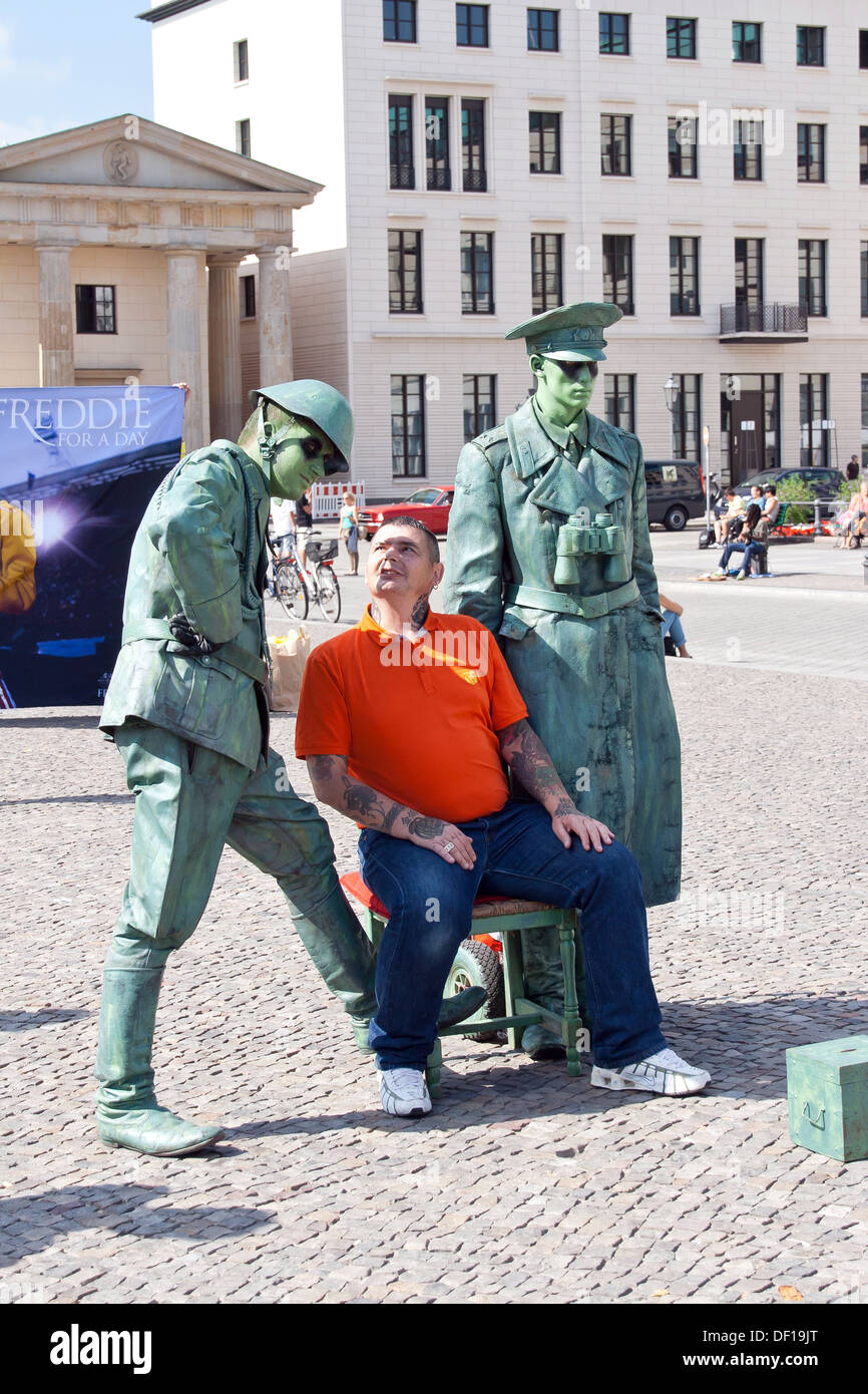 Berlin at the Brandenburg Gate, summer 2013 - Pariser Platz and tourists with Soldiers Stock Photo