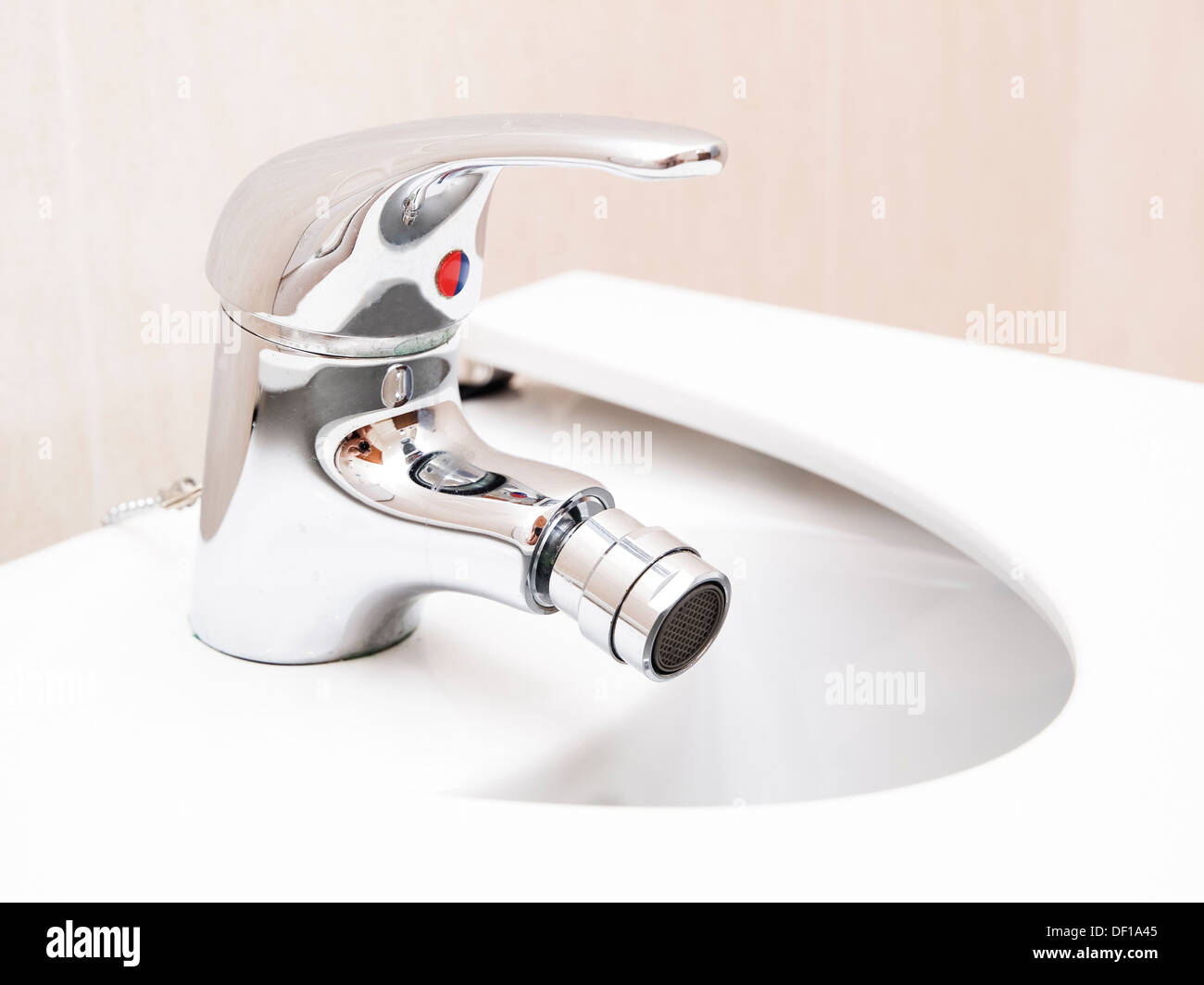 Chrome mixer tap in a bathroom Stock Photo