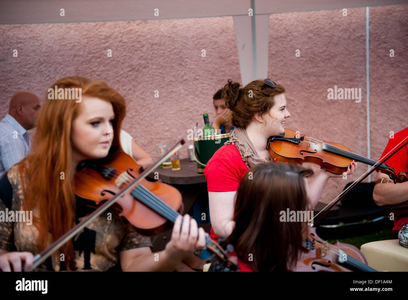 Red hair and violins Stock Photo Alamy