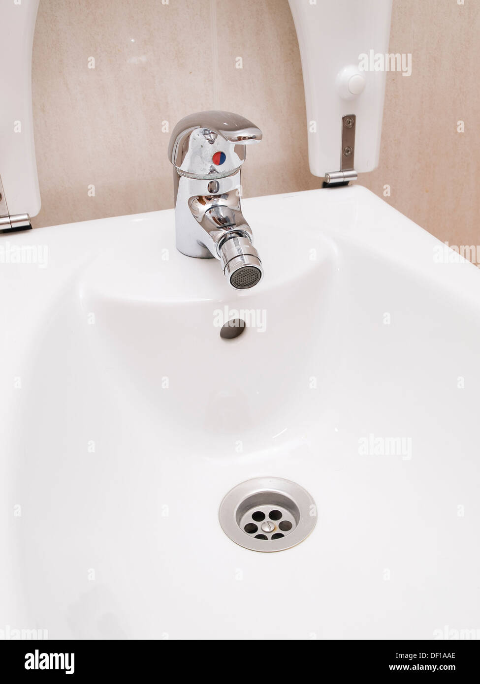 Bidet detail with tap and drain Stock Photo