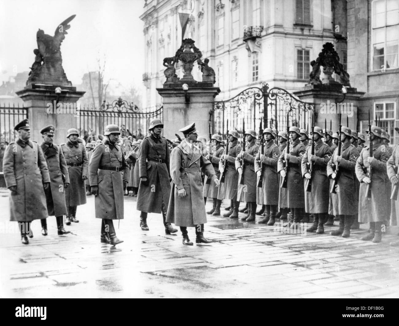 The image from the Nazi Propaganda! shows Adolf Hitler marching past an honorary company in the Castle District in Prague, Czech Republic, after the invasion of the so-called 'Remainder of Czechia' by the German Wehrmacht , on 16 March 1939. From here, he announced the establishment of the 'Protectorate of Bohemia and Moravia', which meant the dissolution of Czechoslovakia as a sovereign state. Fotoarchiv für Zeitgeschichte Stock Photo