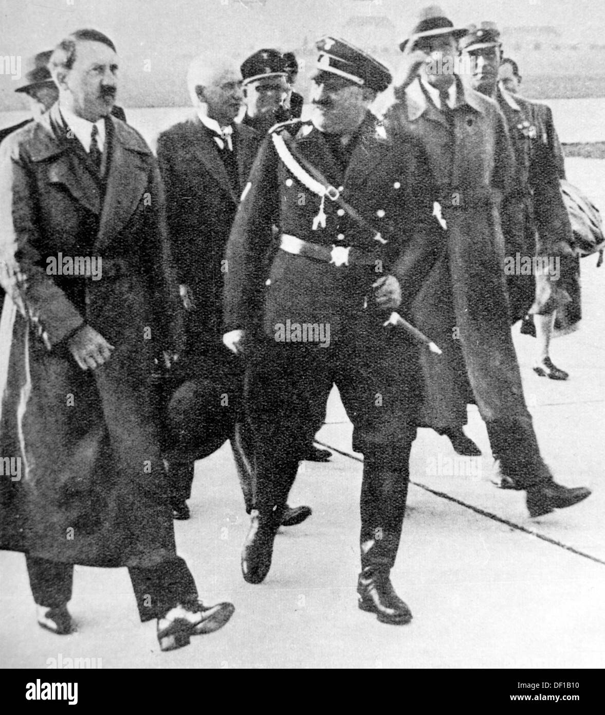 The image from the Nazi Propaganda! shows Adolf Hitler with NSDAP city councilman Christian Weber upon his arrival at the airport in Munich, Germany, in January 1934. Fotoarchiv für Zeitgeschichte Stock Photo