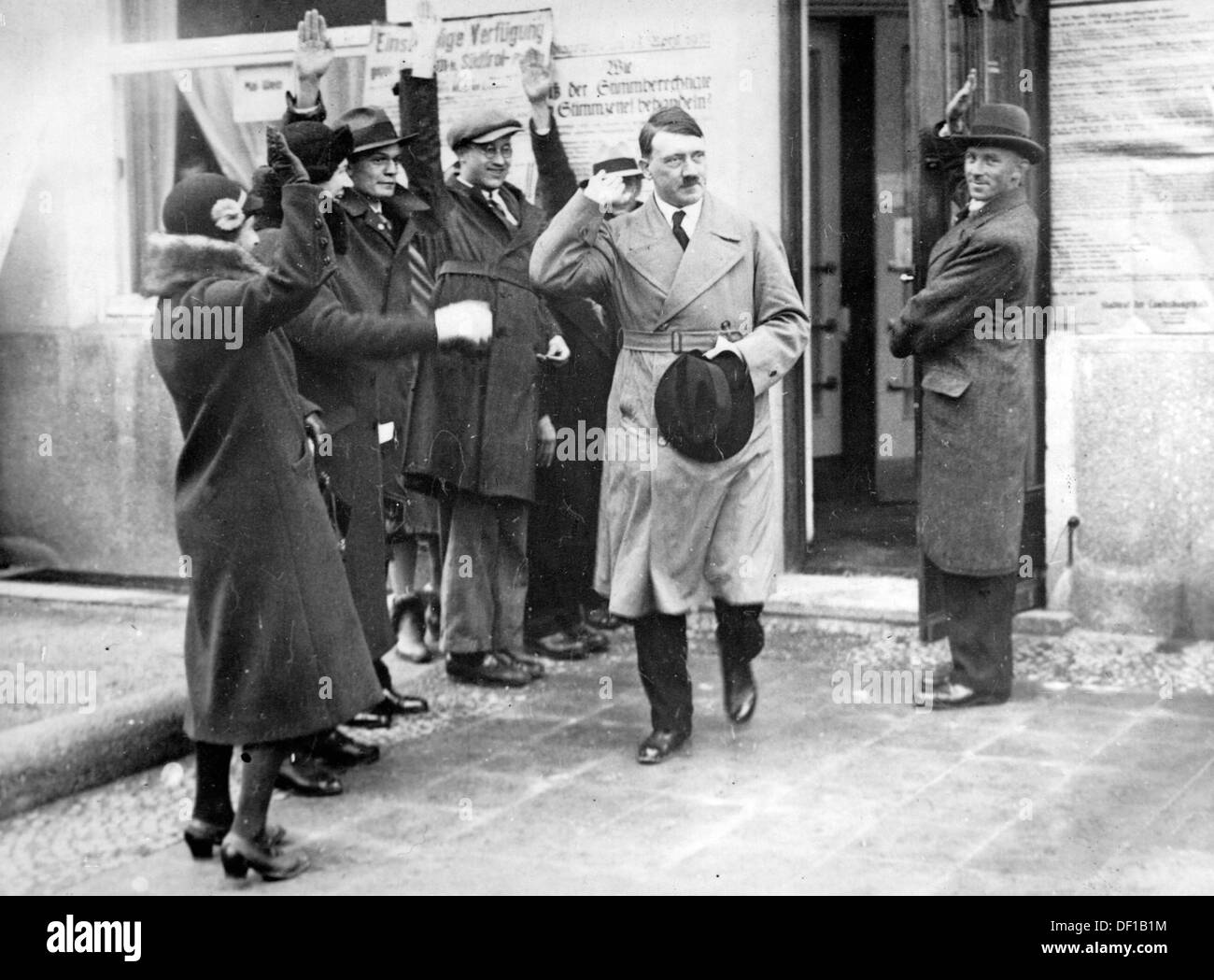 The image from the Nazi Propaganda! shows Adolf Hitler leaving a polling station in Munich, Germany, in the context of the election of the state government in Bavaria on 24 April 1932. Fotoarchiv für Zeitgeschichte Stock Photo