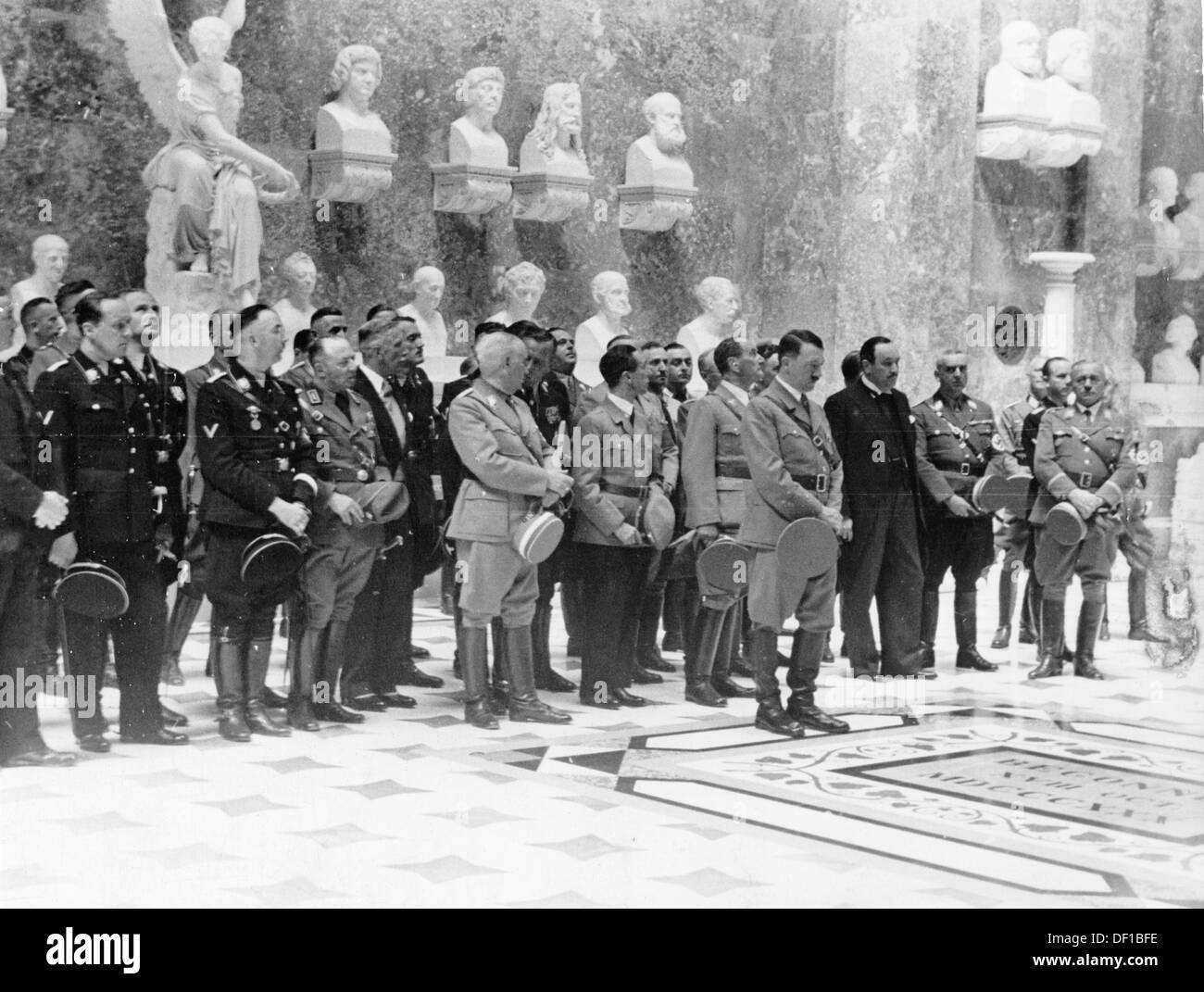 The image from the Nazi Propaganda! shows Hitler on the occasion of the unveiling of the bust for the "German naturalized" Austrian composer Anton Bruckner in the Walhalla in Regensburg, Germany, 6 June 1937. Front row l-r: Reich Minister Franz Gürtner (left margin), Reich Minister Walther Darré, Reichsführer SS Heinrich Himmler, unknown, the ambassador of the German Reich in Vienna Franz von Papen, Bavarian Premier Ludwig Siebert (in conversation), Joseph Goebbels, Franz Ritter von Epp, Hitler, Austrian ambassador in Germany Stephan Tauschitz (in white tie). Fotoarchiv für Zeitgeschichte Stock Photo