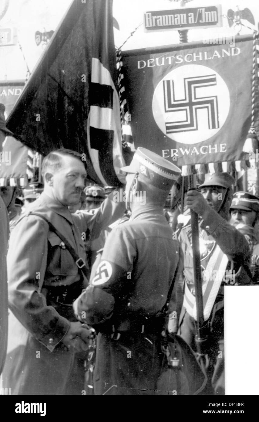 Image of Adolf Hitler during the flag parade on the occasion of the Nuremberg Rally of the NSDAP in Nuremberg, Germany, in front the SA regiment 'Germany wake up - Braunau a. Inn'. Date unknown. Fotoarchiv für Zeitgeschichte Stock Photo