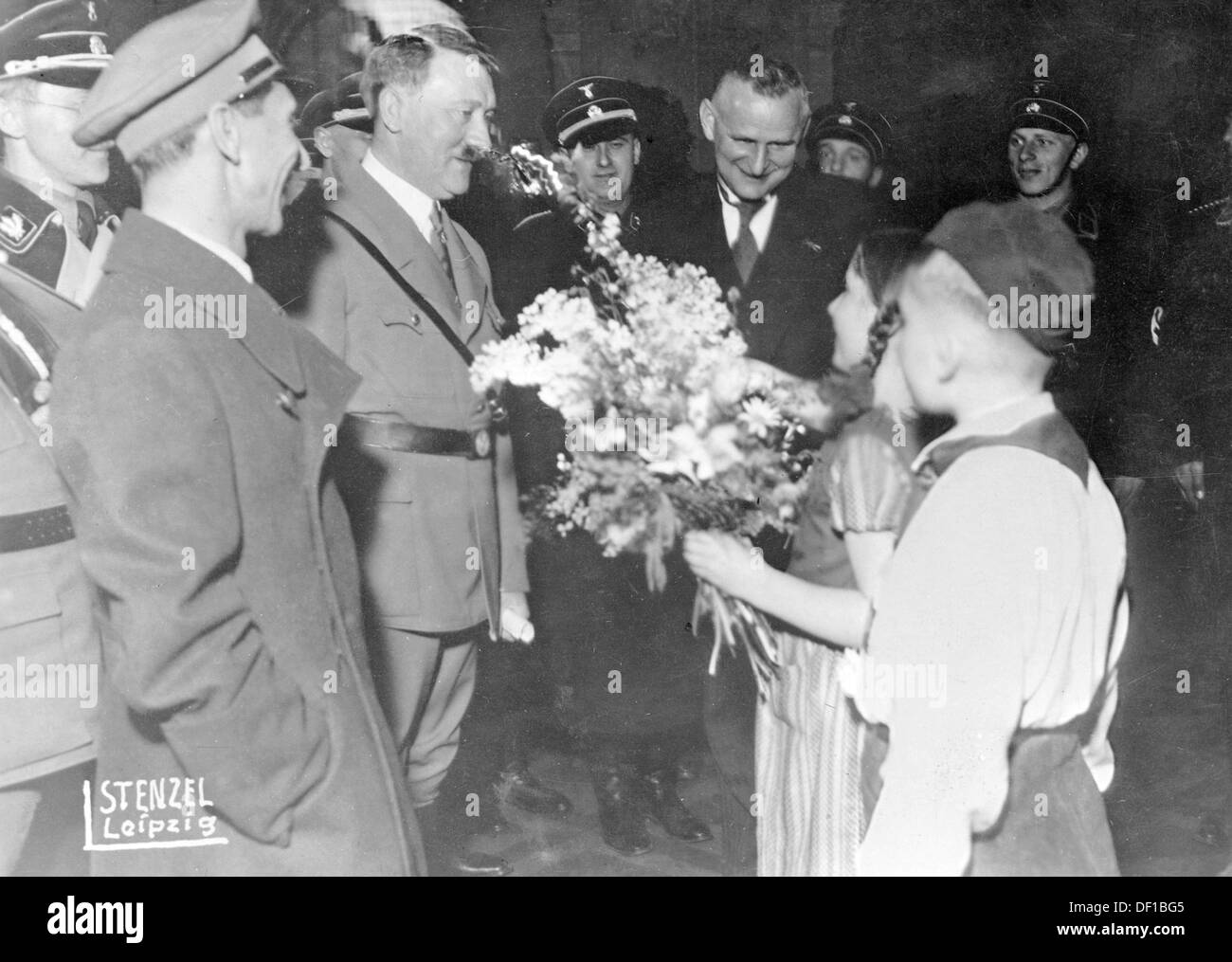 The image from the Nazi Propaganda! shows Adolf Hitler being welcomed by mayor Carl Friedrich Goerdeler (r, in suite) in the Neue Rathaus in Leipzig, Germany, in 1934. To the left, Reich Minister for Propaganda! Joseph Goebbels. Fotoarchiv für Zeitgeschichte Stock Photo