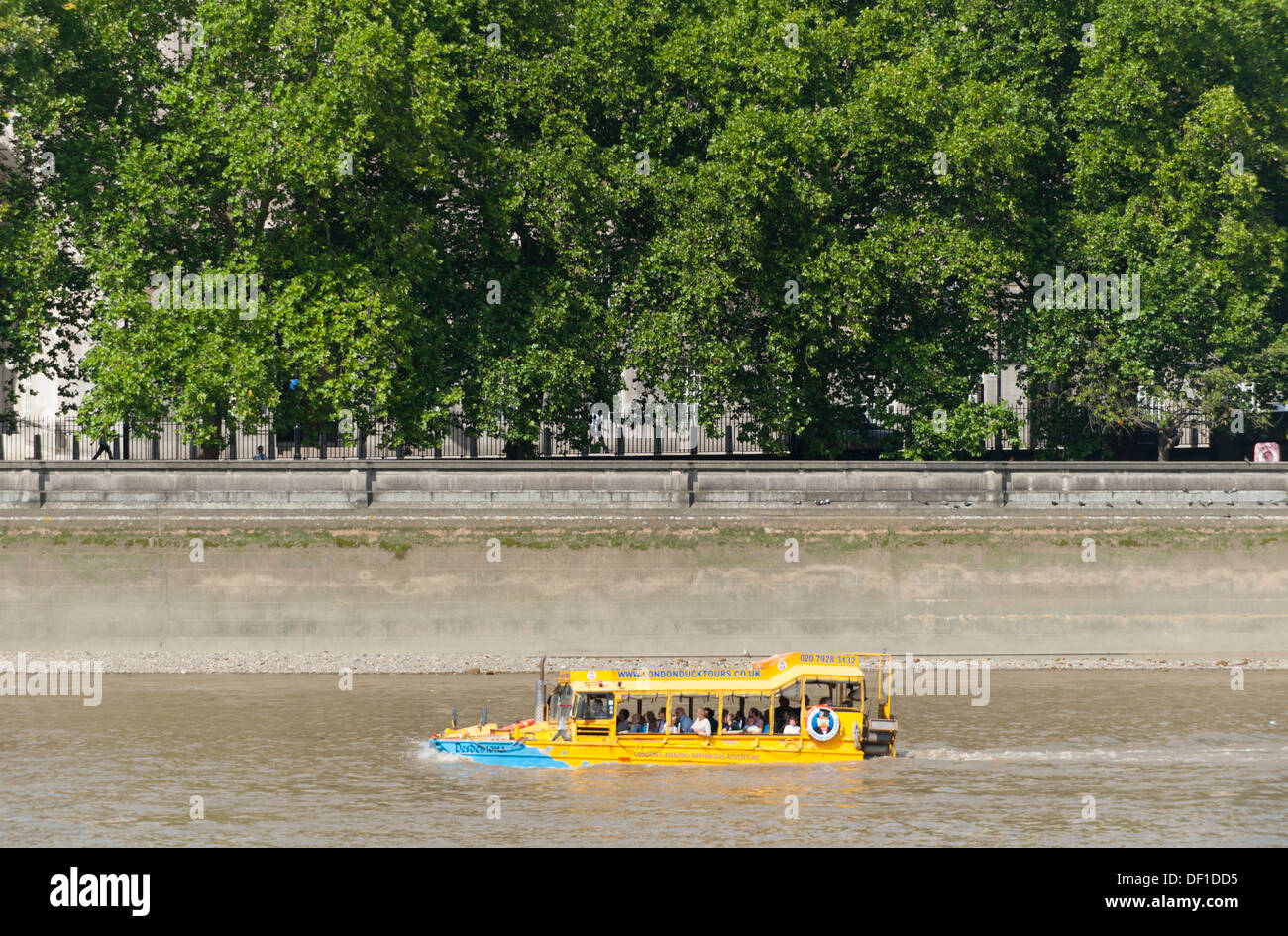 Amphibious boat with tourists travelling upstream on the river Thames in central London at Victoria Tower Gardens in Westminster Stock Photo