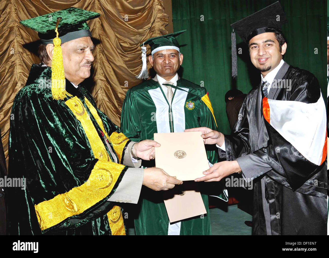 ISLAMABAD/ PAKISTAN . 26 setp 2013 Handout image by PID President Mamnoon  Hussain giving away certificates to the graduating students at the  Convocation Ceremony of National Defence University (NDU) at NDU, Islamabad, image size:1300x1019