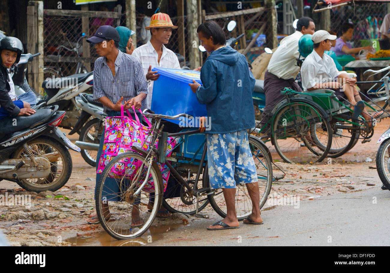 Burmese people go about their daily life in Mawlamyine, Burma. Stock Photo