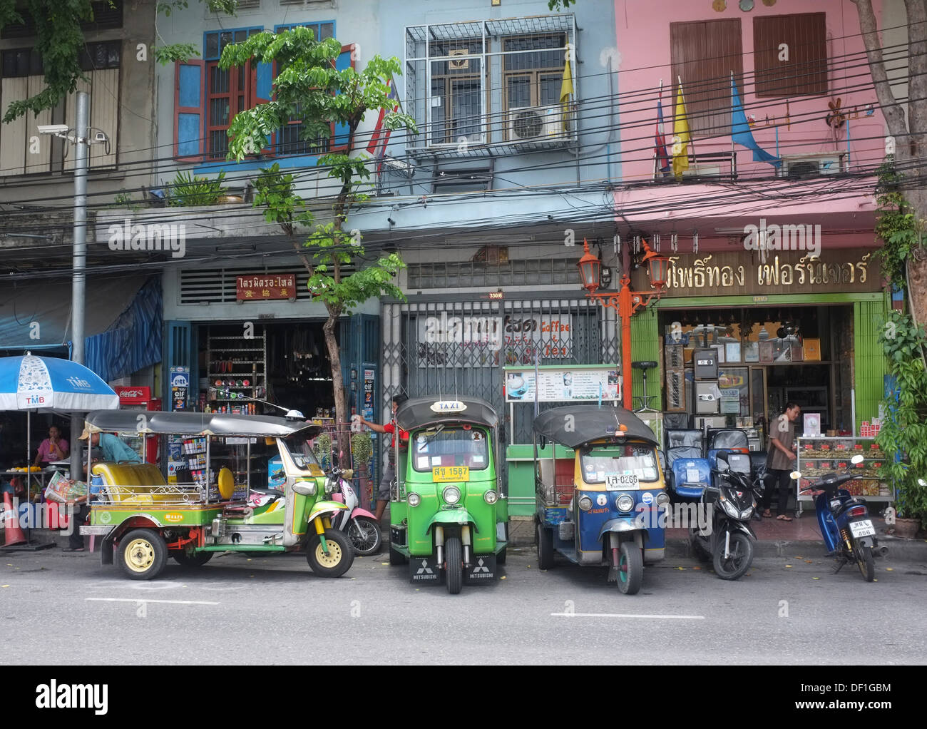 Street scene with tuk tuks, Bangkok Stock Photo