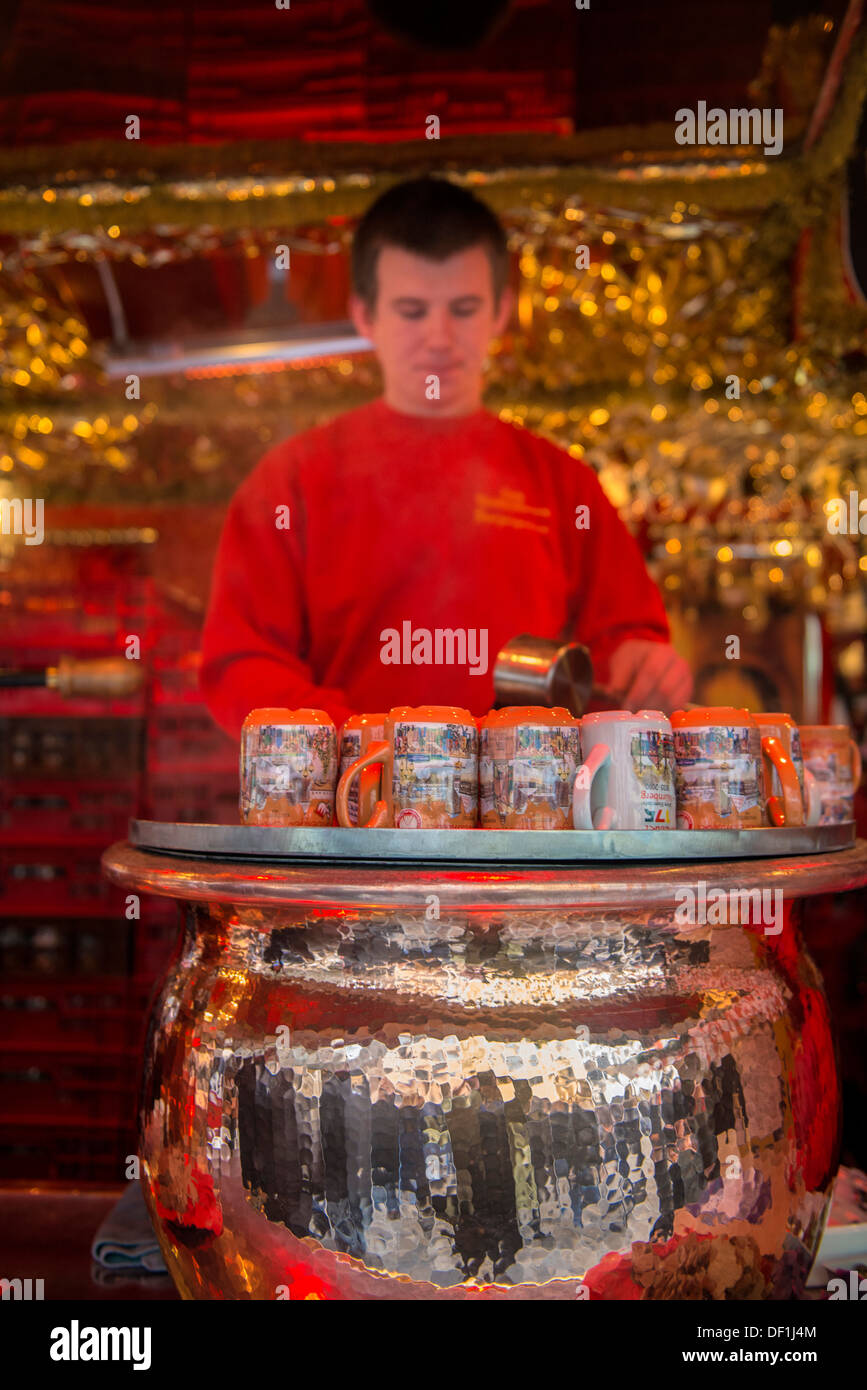 Man making gluhwein at Christmas Market, Nuremberg, Germany Stock Photo