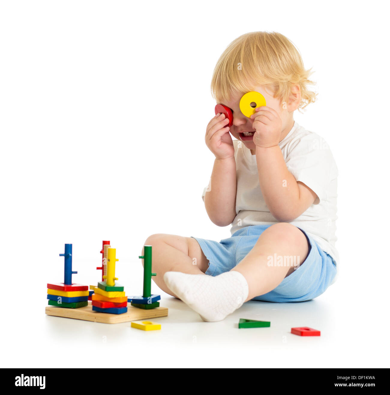 fancy kid making spectacles from toy parts Stock Photo