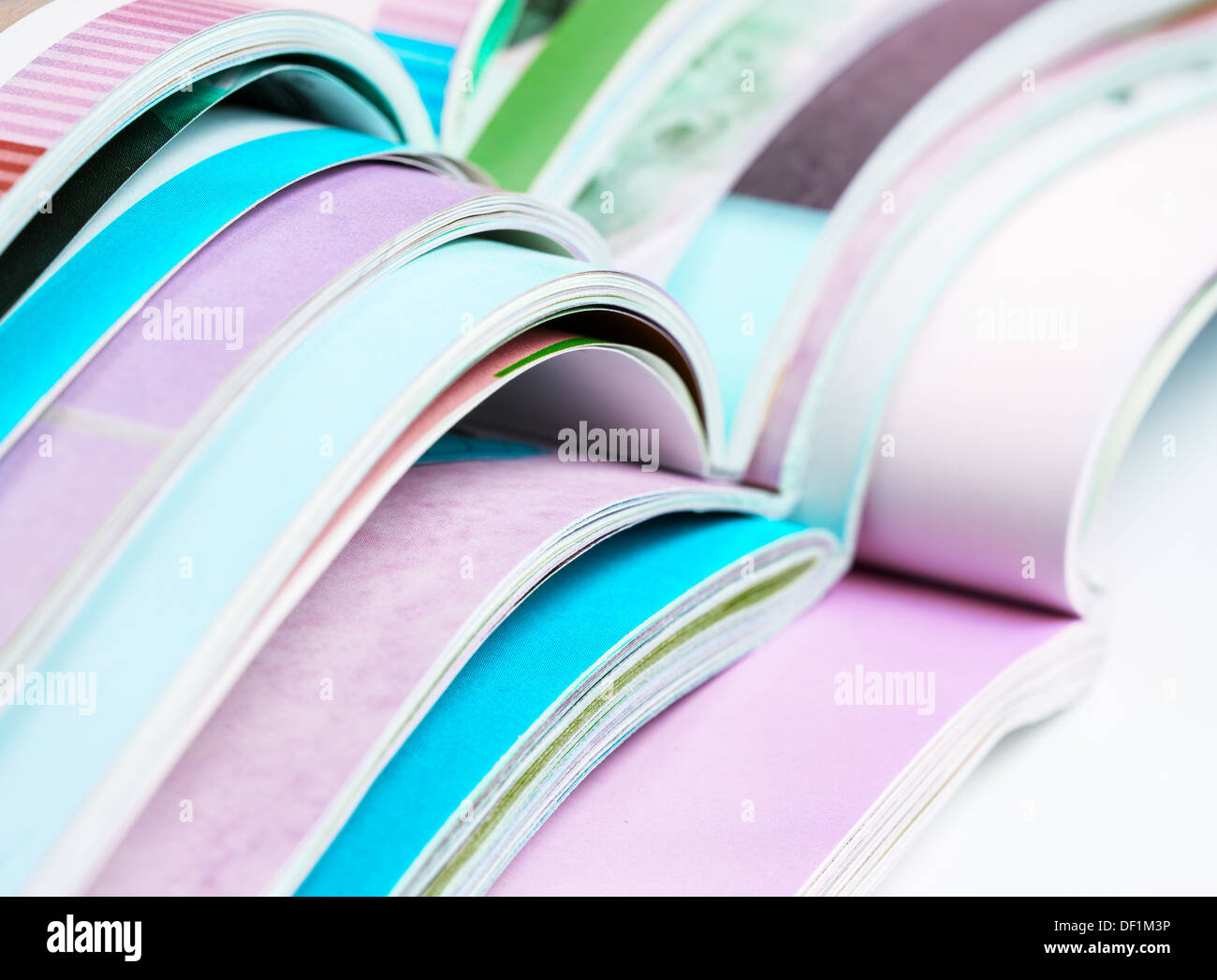 Pile of opened magazines Stock Photo