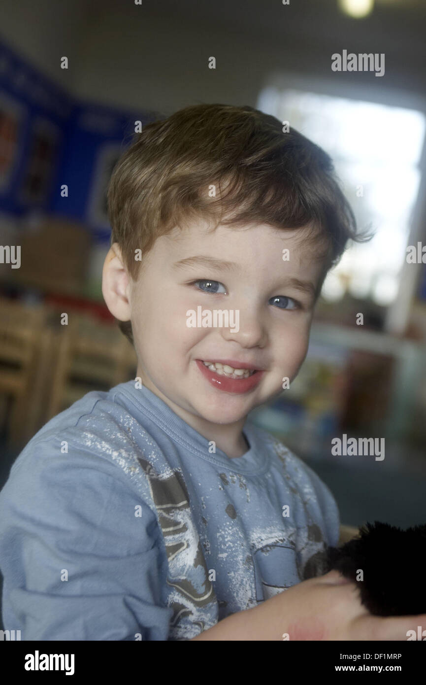 3 year old boy looking into camera at nursery Stock Photo Alamy