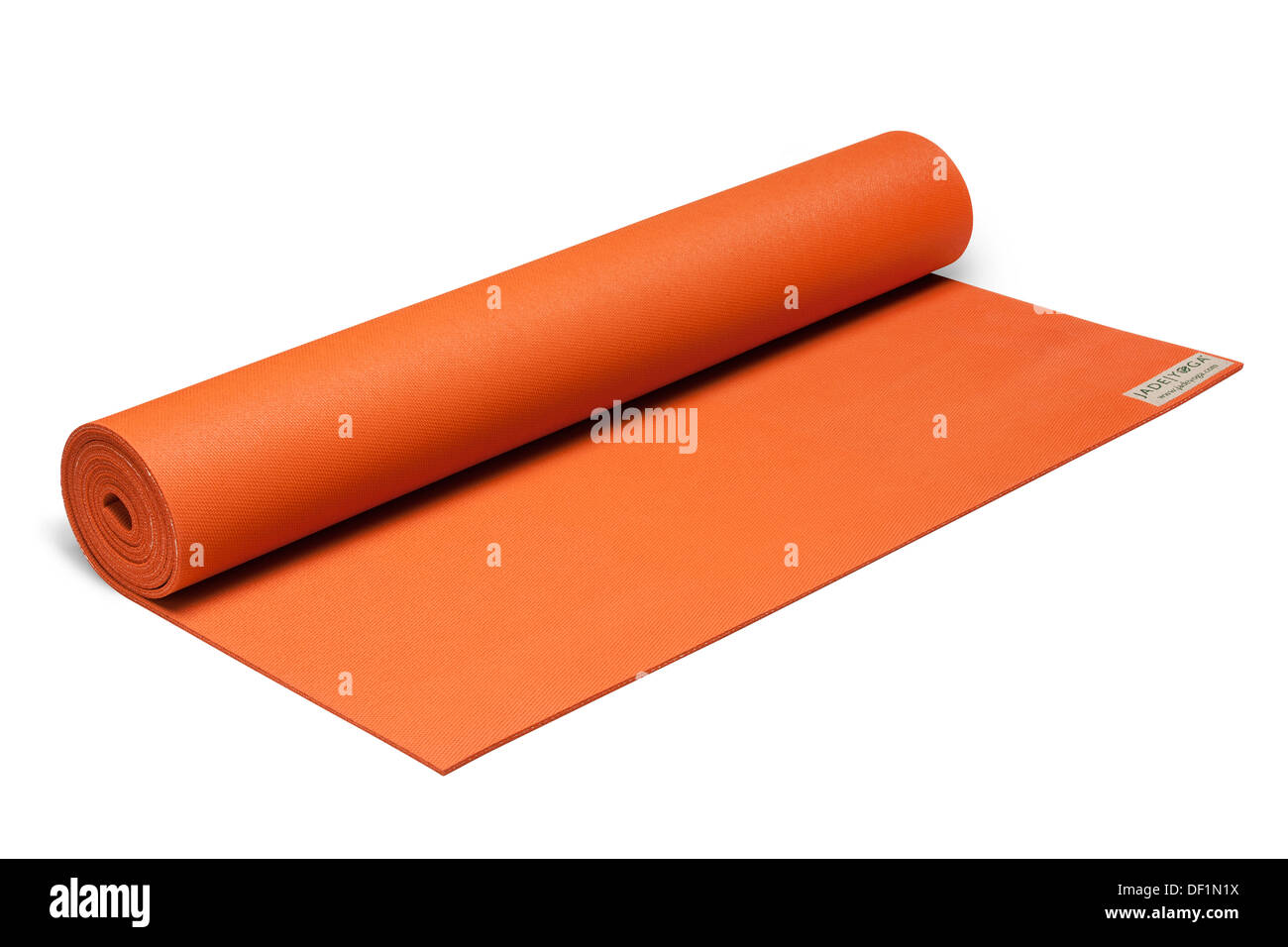 coloured yoga exercise roll mat isolated on white background product image. Stock Photo