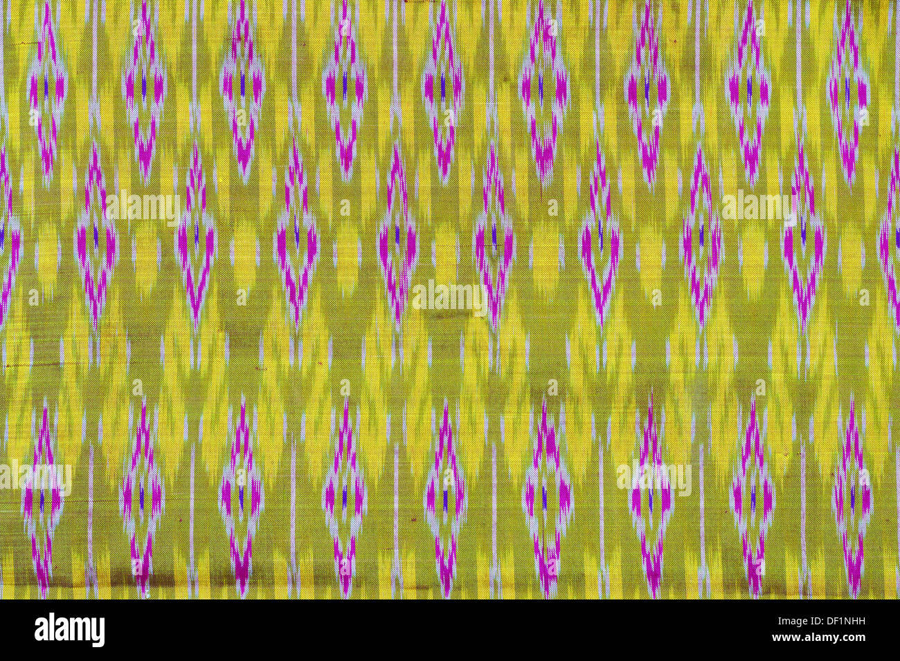 photograph of a pattern yellow and purple. Asian fabric texture Stock Photo