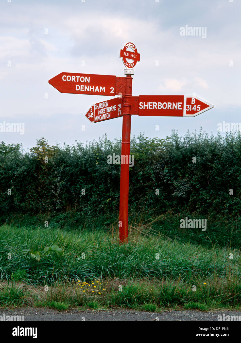 A Dorset 'Red Post' signpost beside the B3145 road 3 miles N of the centre of Sherborne, Dorset