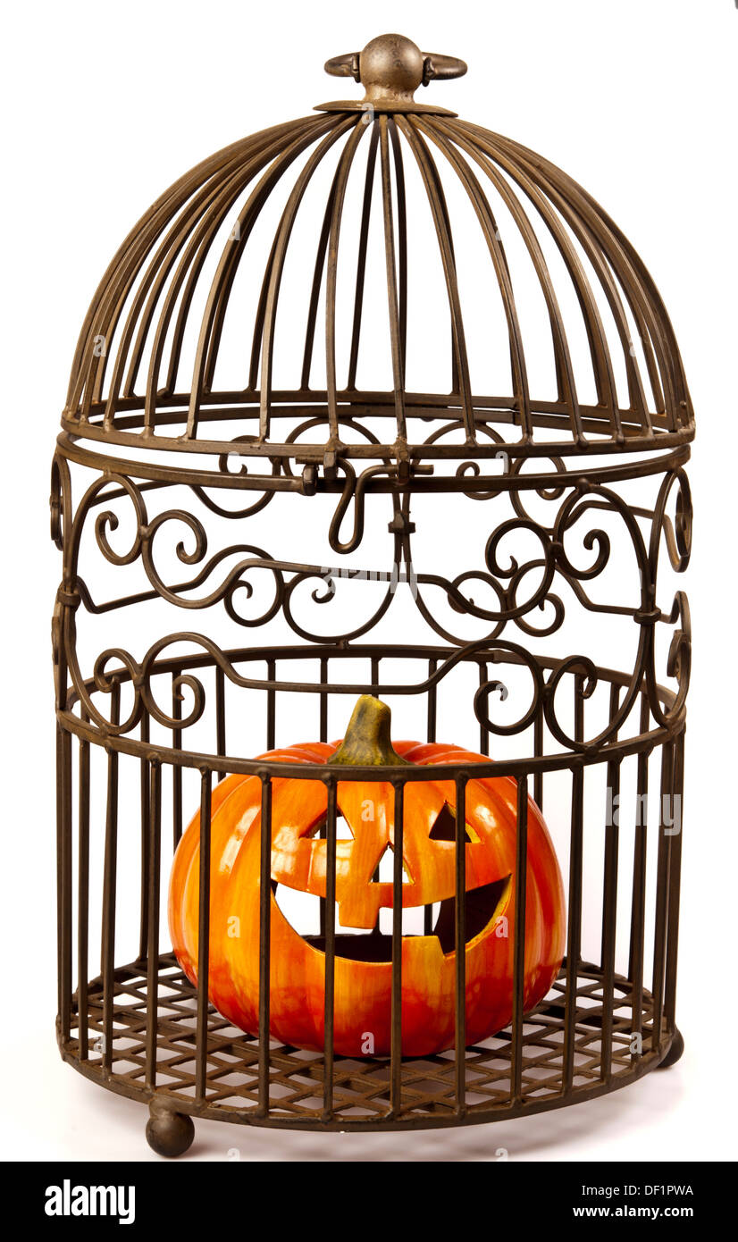 Halloween pumpkin jack-o'-lantern  into a cage Stock Photo