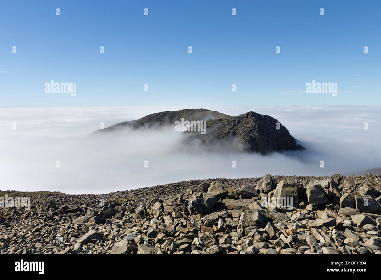 Sca Fell Surrounded by a Sea of Cloud Created by a Temperature Inversion Viewed from the Summit of Scafell Pike Lake District UK Stock Photo