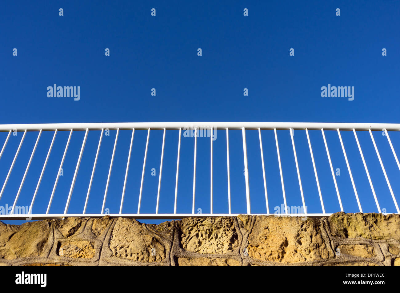 white railing against blue sky Stock Photo