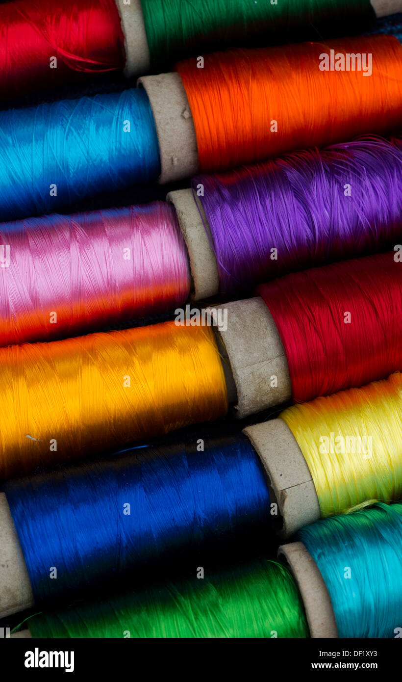 Colourful spools of Indian silk embroidery thread. India Stock Photo
