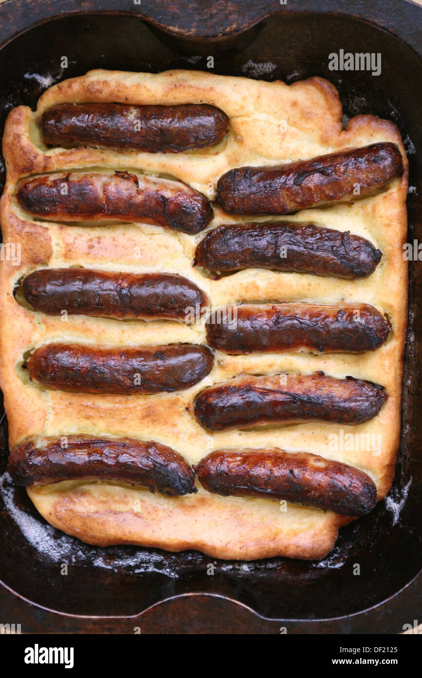 Toad in the hole sausages in batter Stock Photo Alamy