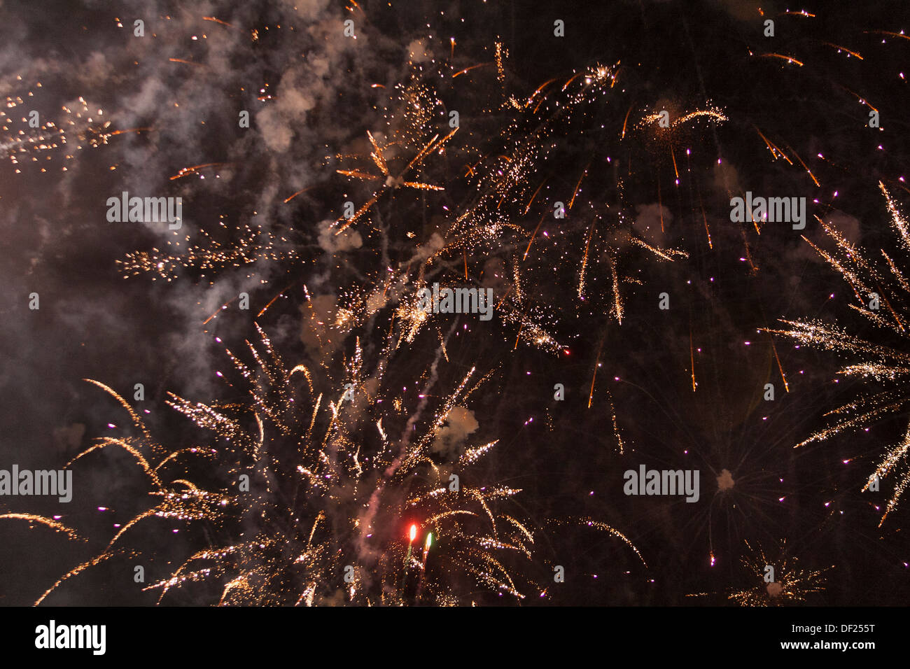A bright burst of fireworks against black sky Stock Photo