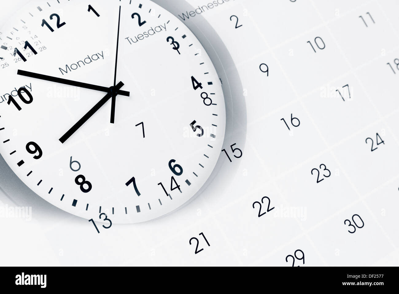 Clock face and calendar page Stock Photo