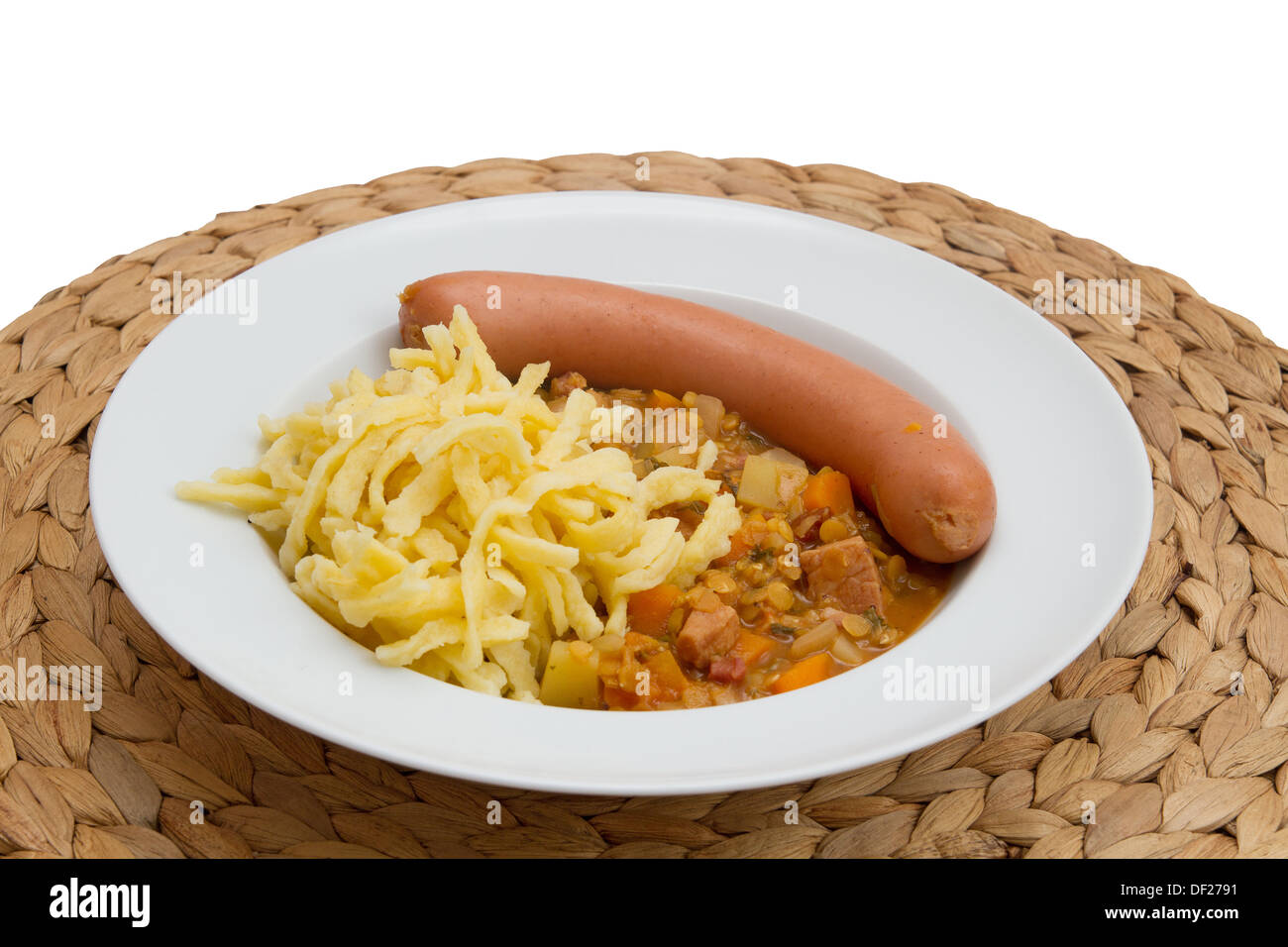 Lentils with spaetzle (noodles) and frankfurter sausage Stock Photo