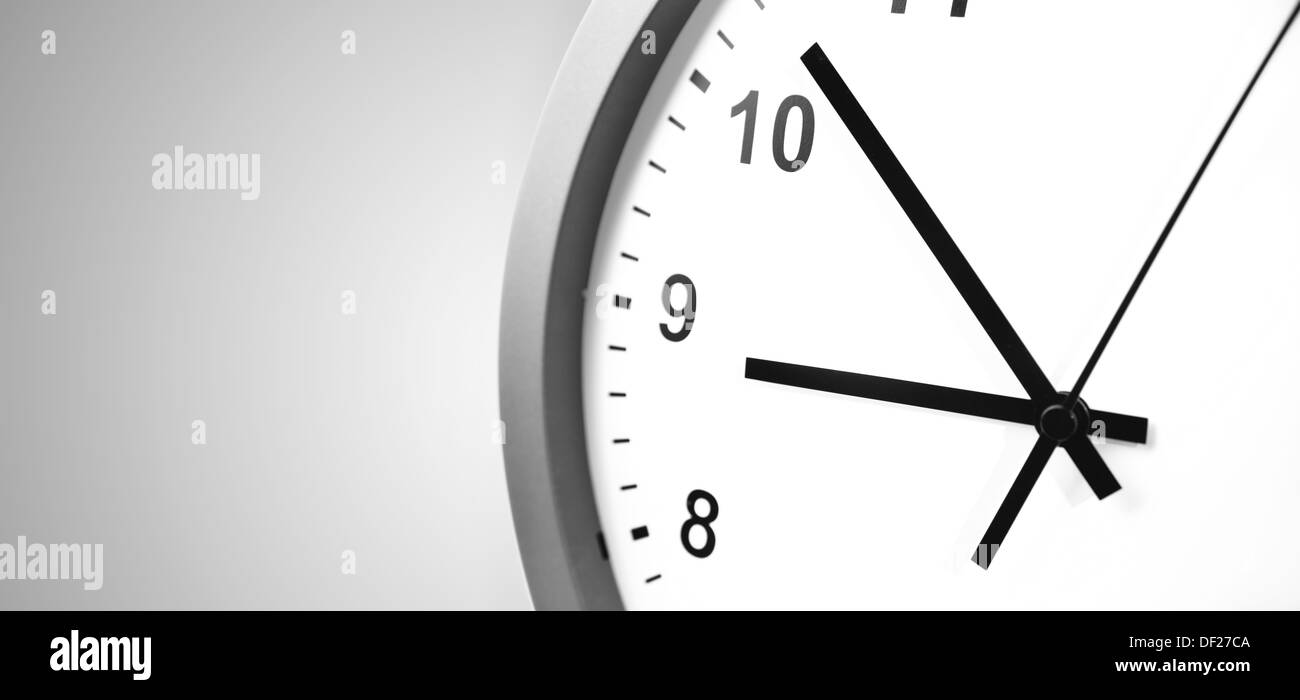 Closeup of clock on gray background Stock Photo