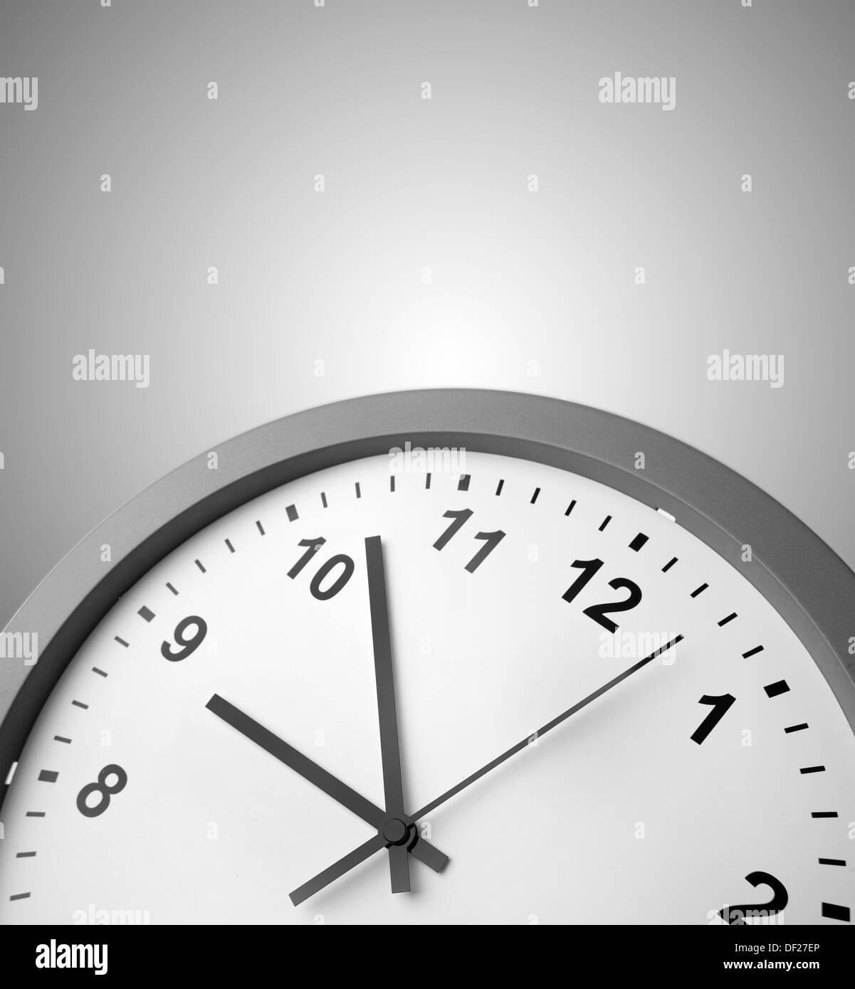 Closeup of clock on gray background Stock Photo