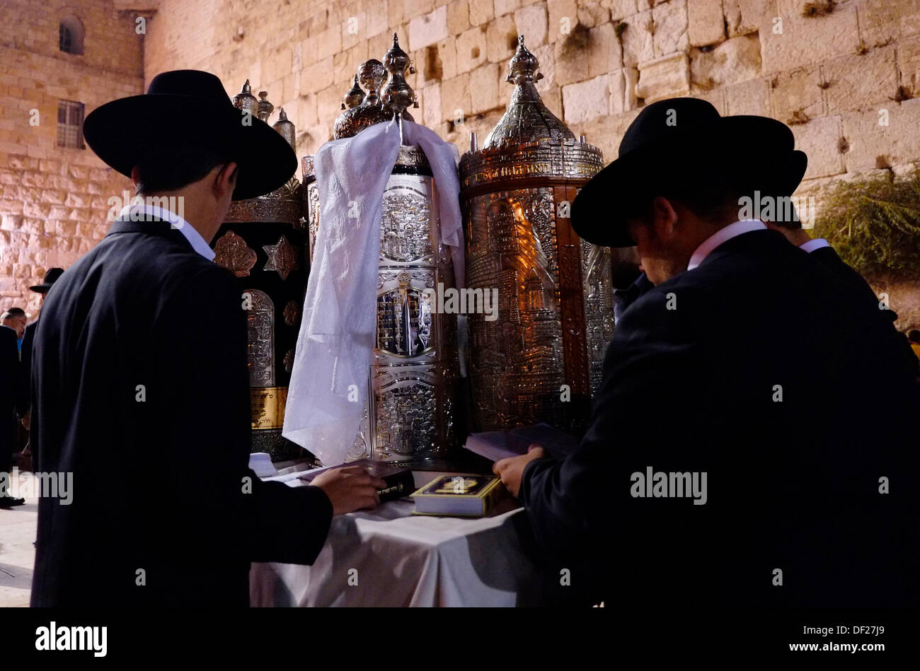 Ultra Orthodox Religious Jewish men celebrating the Simchat Torah a Jewish holiday that celebrates and marks the conclusion of the annual cycle of public Torah readings, and the beginning of a new cycle in the Western Wall old city East Jerusalem Israel Stock Photo