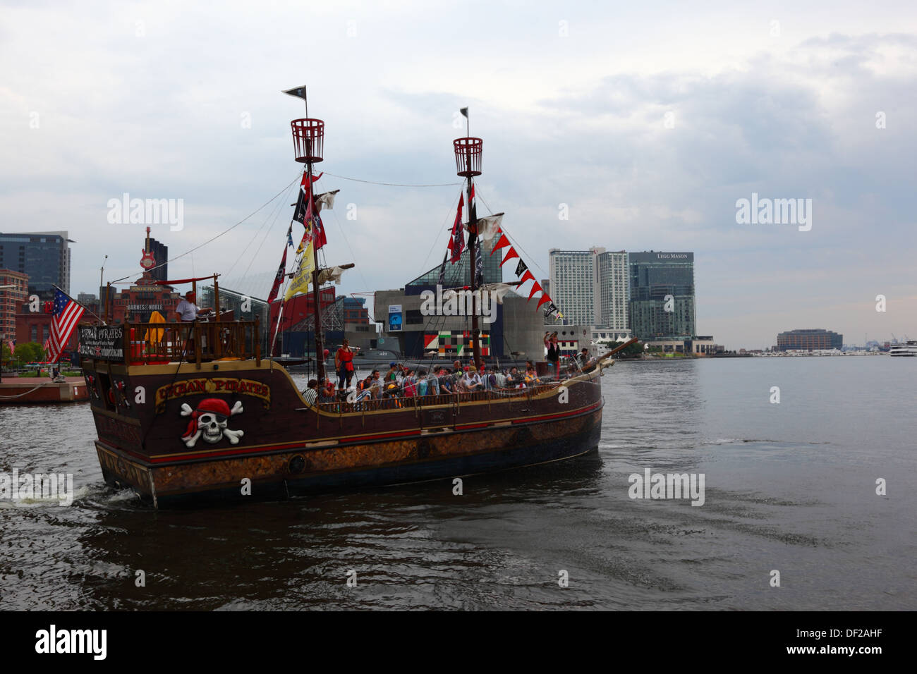 Tourists enjoying an Urban Pirates boat trip around Inner Harbor, Baltimore, Maryland. USA Stock Photo