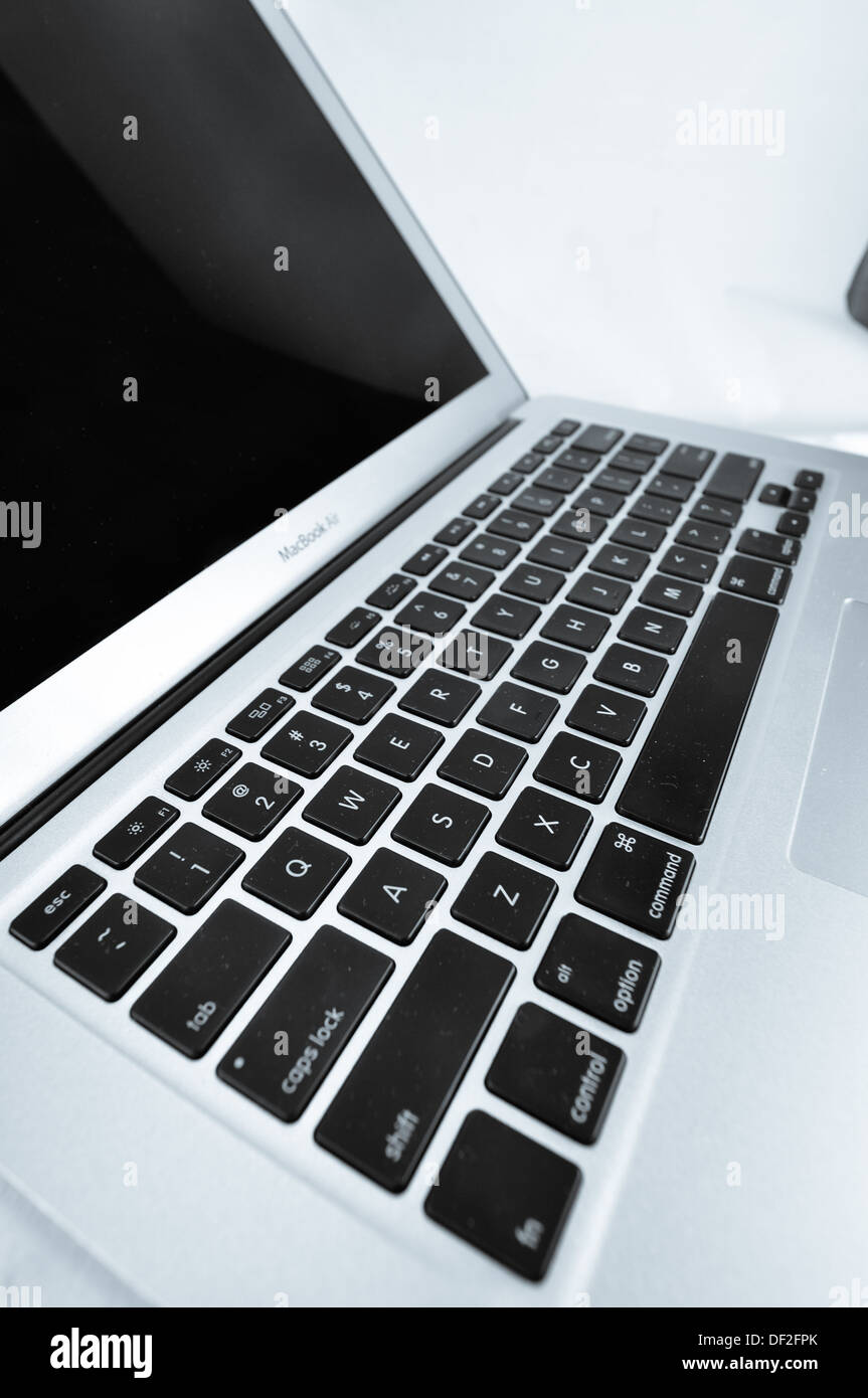 Macbook Air in different silhouette, keyboard and side. Stock Photo