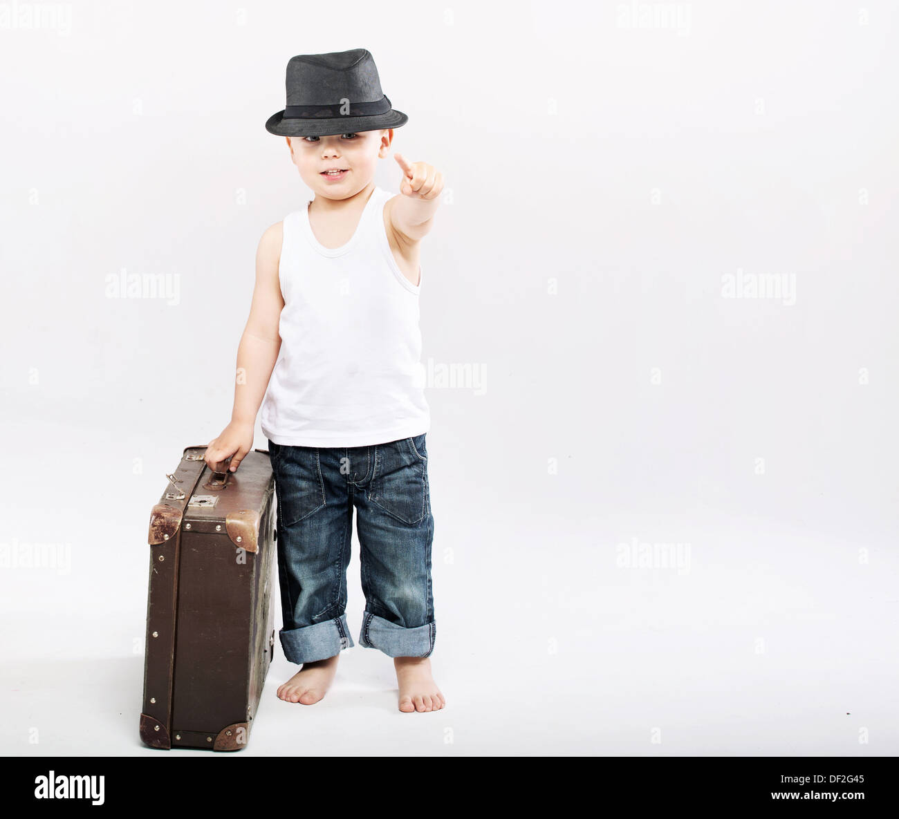 Little gentleman with huge brown suitcase Stock Photo Alamy