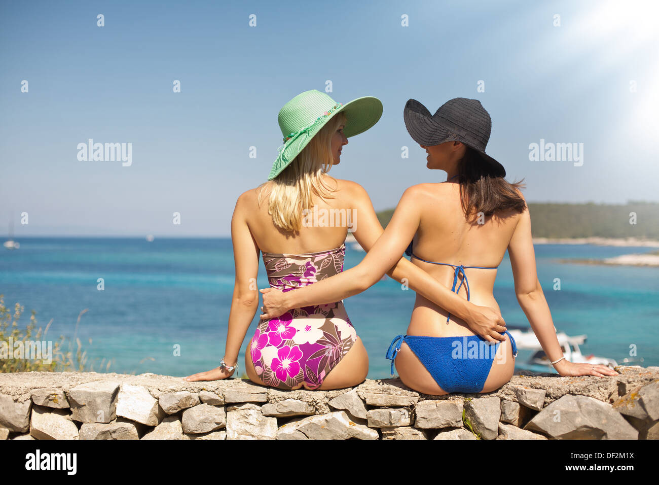 Summer shapely ladies on the beach Stock Photo