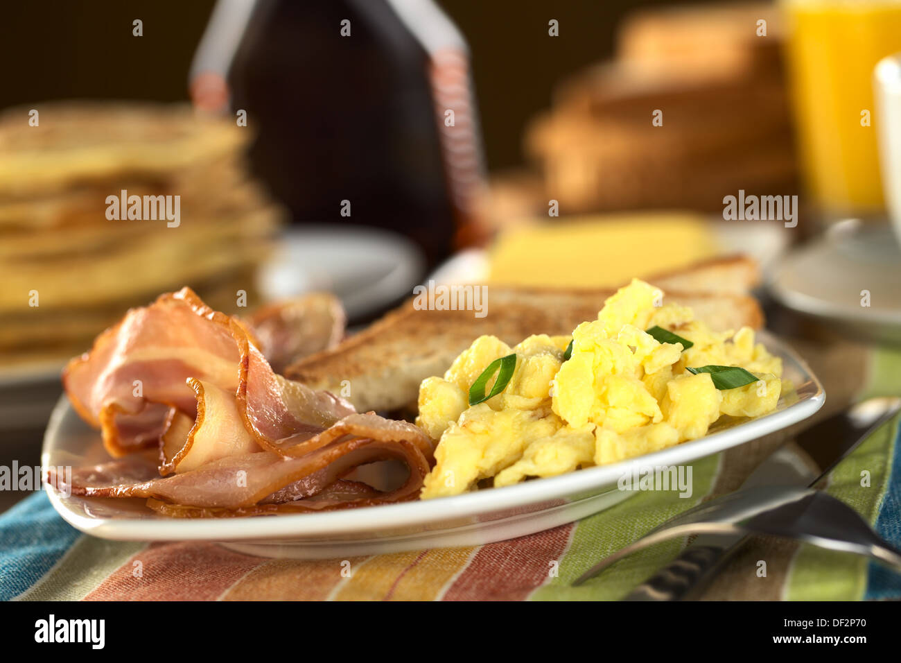 Fried Bacon And Scrambled Eggs With Toast Bread Pancakes And Orange Juice In The Back Stock Photo Alamy Fried Bacon And Scrambled Eggs With Toast Bread Pancakes And Orange Juice In The Back Stock Photo Alamy
