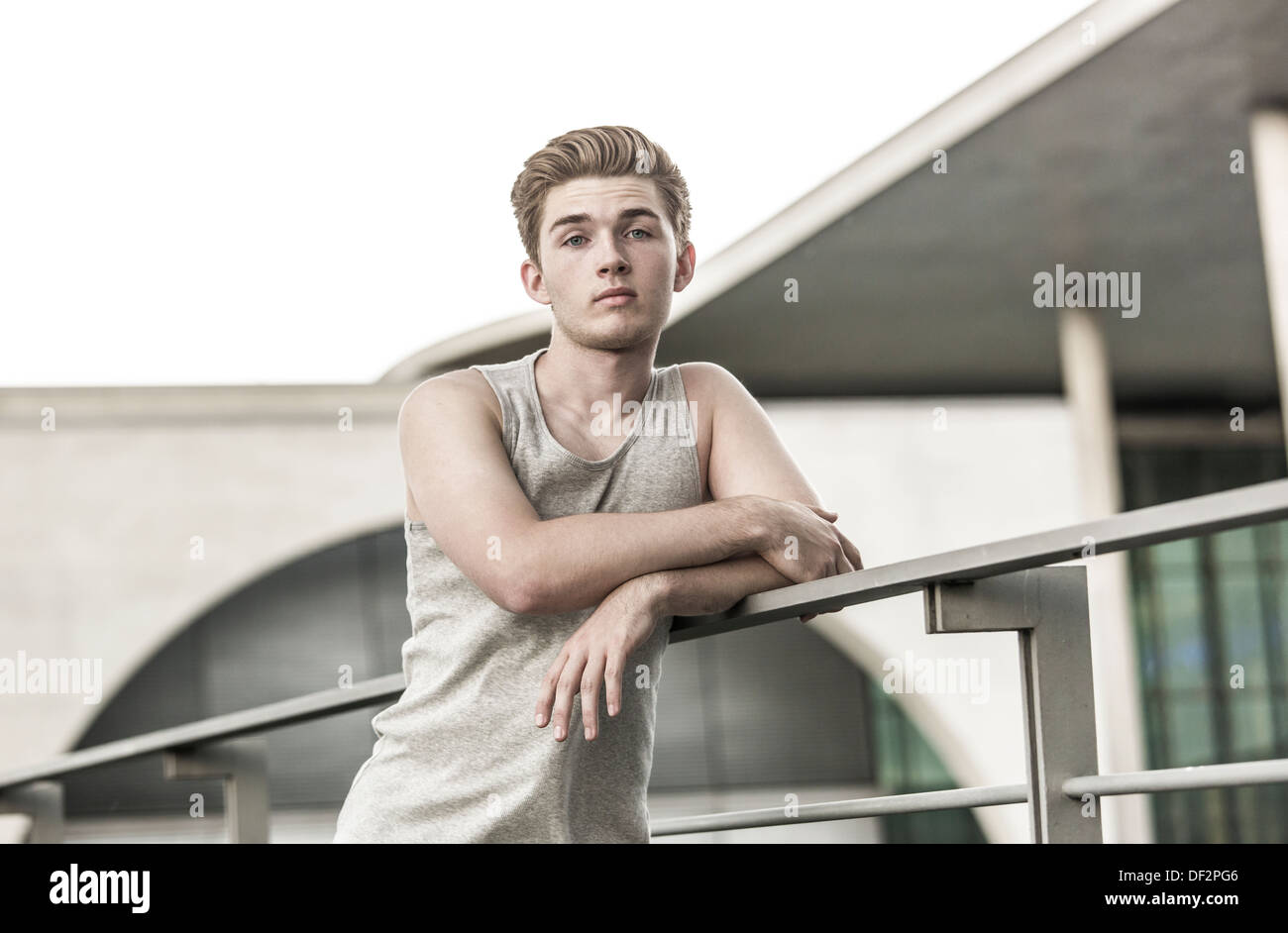Young man standing at railing hi-res stock photography and images - Alamy