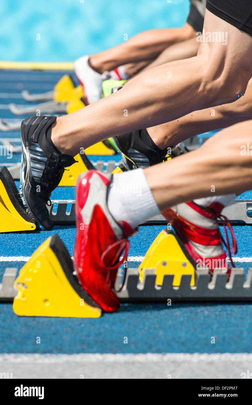 Explosive start of a athletics race out of the blocks Stock Photo