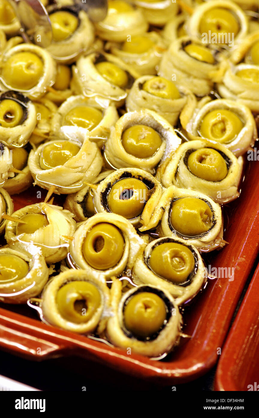 Olives and white anchovies at La Boqueria market, Barcelona. Catalonia
