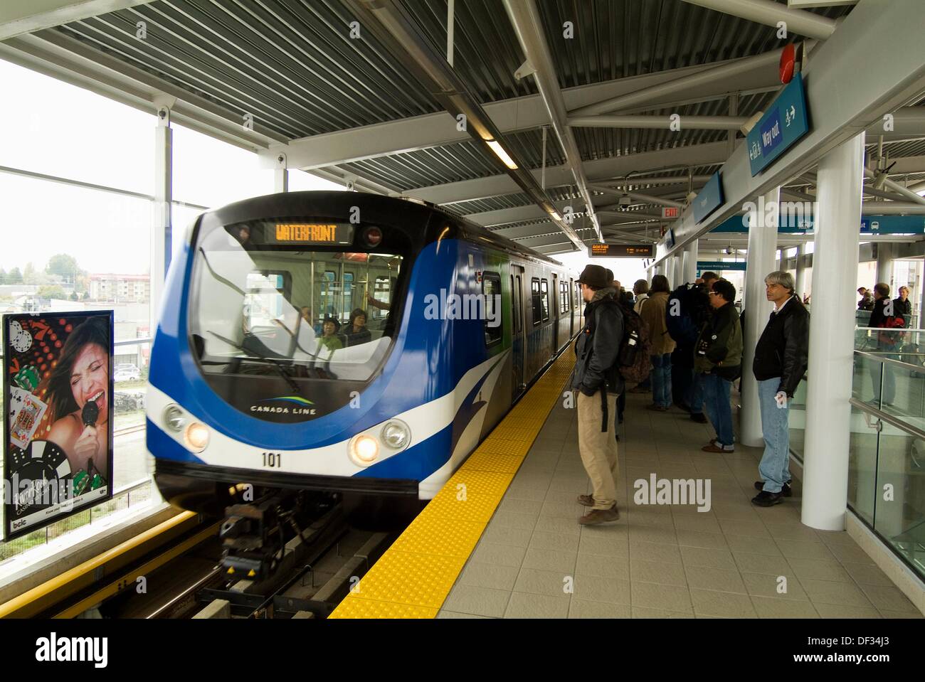 passengers wait on the platform, Skytrain station at Vancouver International Airport, YVR Stock