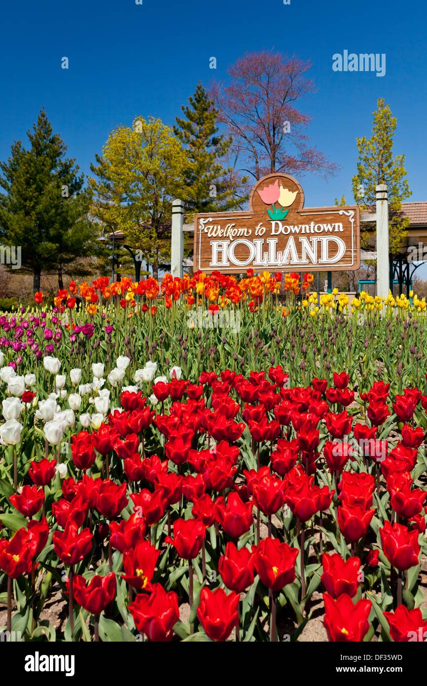 A sign with colorful tulip flower beds in Holland, Michigan