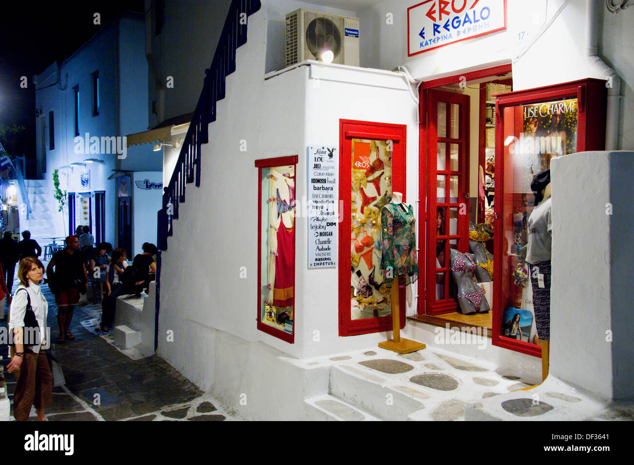 The shops and boutiques of Hora at night on the Greek Island of Mykonos, Greece. Stock Photo
