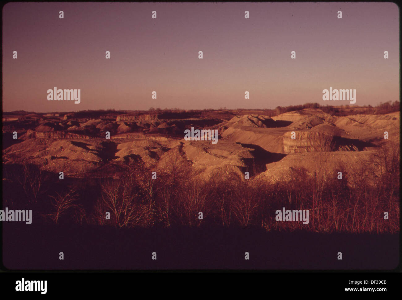 A landscape photograph depicting land that was stripped twenty years earlier, showing the lasting environmental scars along Route 9, illustrating long-term effects of land degradation. Stock Photo